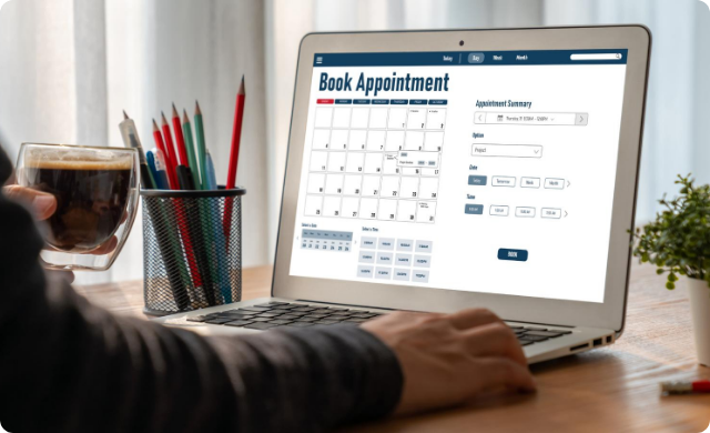 Patient booking a doctor’s appointment online through healthcare scheduling software on laptop